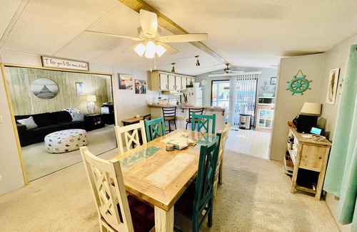 Weeki Wachee Gardens House | Charming 2/2 waterfront farm home with tons of TV stations, WiFi, dock, & more