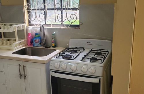 Old Trees Bay House | Charming 2-bedroom bungalow in beautiful Holetown with WiFi, AC, & pool access!