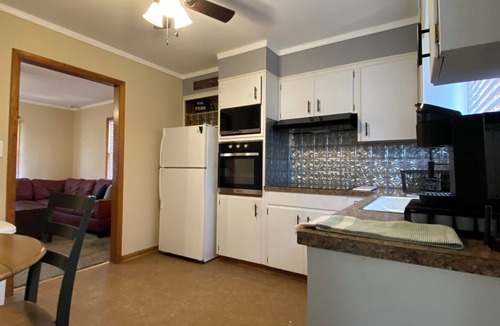 Atchison House | Charming 2-bedroom house in Atchison on quiet brick and tree lined street.