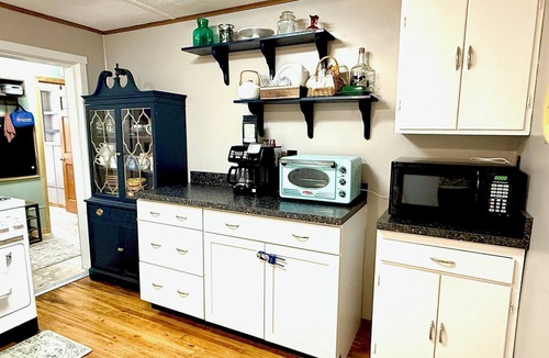 Valley Bend Cottage | Charming 2 BR, nestled on Buckhannon River, with deck, dock, fire-pit, & kayaks