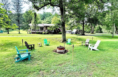 Valley Bend Cottage | Charming 2 BR, nestled on Buckhannon River, with deck, dock, fire-pit, & kayaks