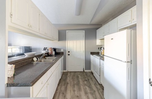 Thomas Drive House | Charming 2BR/2BA Panama City Beach vacation home near white-sand beaches, Ripley’s, Frank Brown Park, and top restaurants. Enjoy comfort, convenience, and easy access to family fun, shopping, and coastal adventures in the heart of PCB.