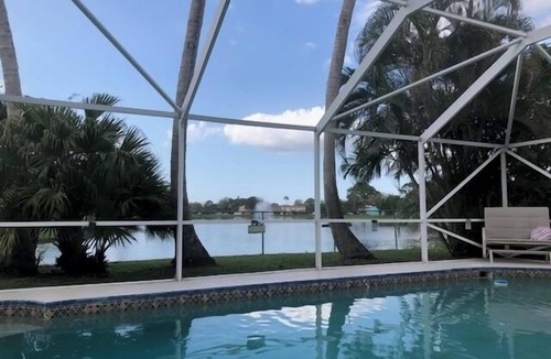 Jupiter Village House | Charming 3-bedroom pool home on the lake with spectacular sunsets & close to all