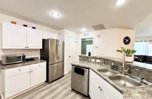 Harris House | Charming 3-bedroom house with screened in heated pool & lanai
