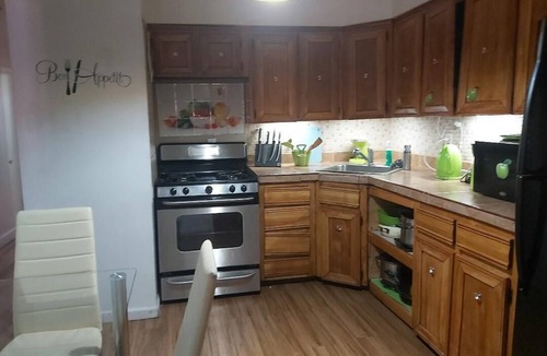 Queens House | Charming 4-bedroom, 2 bath, balcony townhome in Queens