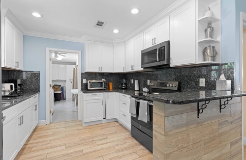 Tequesta House | Charming 4-Bedroom Beach Bungalow with Idyllic Pool & Backyard