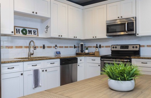 Lincolnville House | Charming Bungalow with Golf Cart Access & Hot Tub, Steps from Heart of the City!