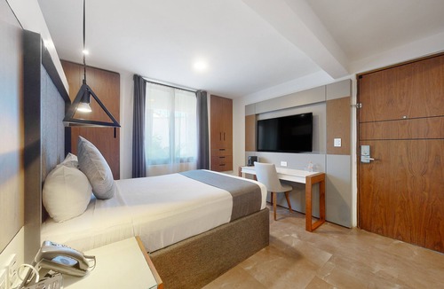Downtown Cancun Hotel | Charming condo with kitchenette, balcony, & pool