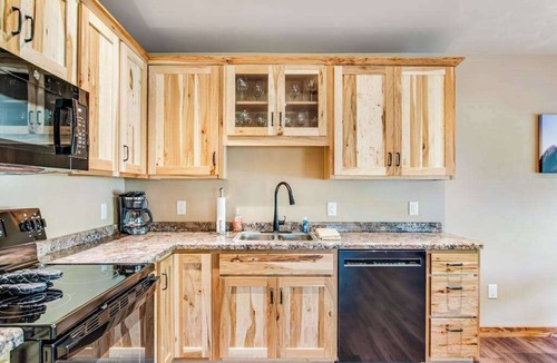 Conover House | Charming dog-friendly cabin with hot tub, fireplace, patio, grill, & central AC