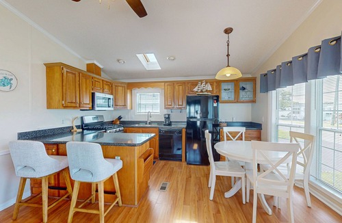 Assateague Pointe House | Charming getaway with modern amenities, tennis court, pool, & private patio