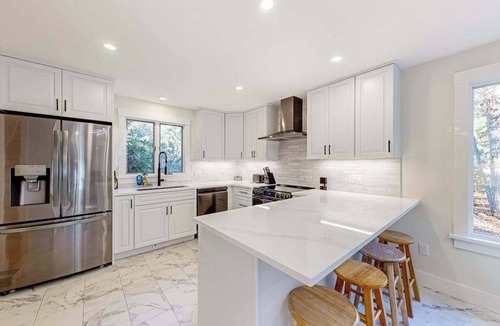 Lagoon Heights House | Charming home with private hot tub, firepit, deck, grill, outdoor shower, AC