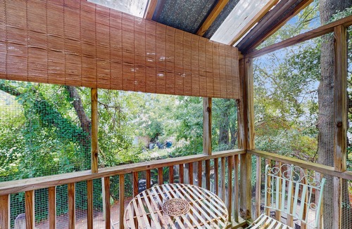 Beach Institute Apartment | Charming home with screened patio, backyard dining & cozy reading nook