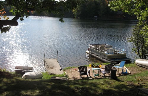 Evart Cottage | Charming Lakefront Cottage, Private Sandy Beach, Excellent Fishing