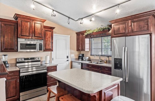 Millcreek House | Charming Mountain Retreat with Enclosed Backyard and Artistic Flair