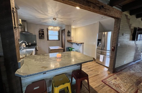 Valley Bend House | Charming, remodeled farmhouse on the river to kayak with a hot tub & a firepit!