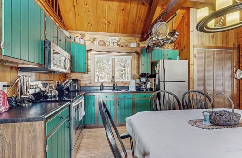 Wiscasset House | Charming riverfront home with cozy interiors, dock, and scenic deck views