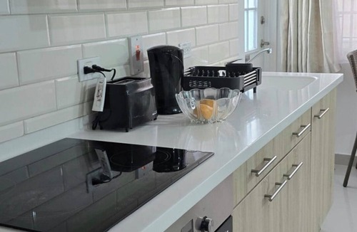 Oistins Apartment | Charming studio in quiet, adorable location in Christ Church with WiFi, AC & TV.
