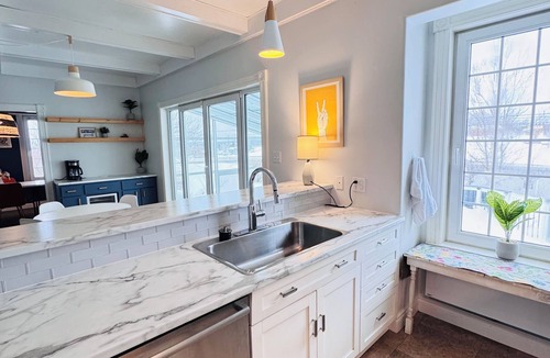 Antigonish House | Charming Sunroom Home with Cozy Living Spaces