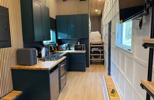 Crouse House | Charming Tiny Home with 1 bedroom and 2 lofts and WiFi, AC in wonderful Dallas.
