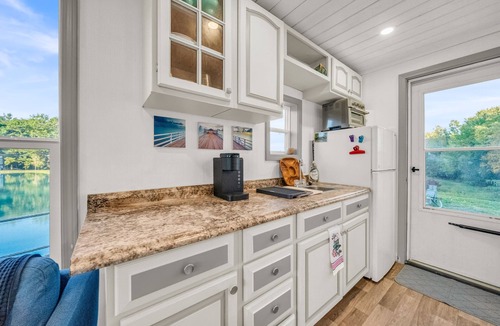 Brackney Boat Rental | Charming Tiny Houseboat Cozy Front Porch Literally on the Water!