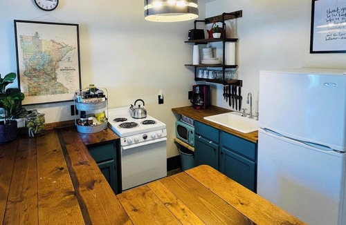 Brainerd Cabin | Charming 1BR riverside cabin in Brainerd, MN. River sunsets, stocked kitchenette, fire pit, 10 min to downtown. Ideal for couples, small families & remote workers seeking a peaceful Up North escape.