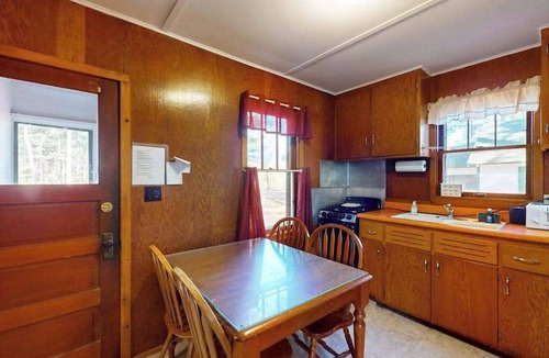 Manitowish Waters House | Charming waterfront cottage with shared firepit, canoe, paddlebaot & docks