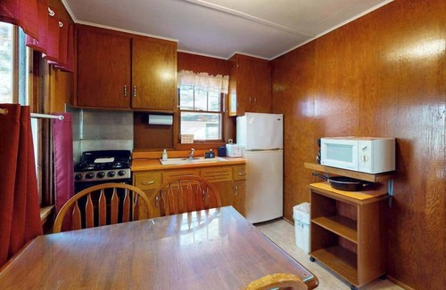Manitowish Waters House | Charming waterfront cottage with shared firepit, canoe, paddlebaot & docks
