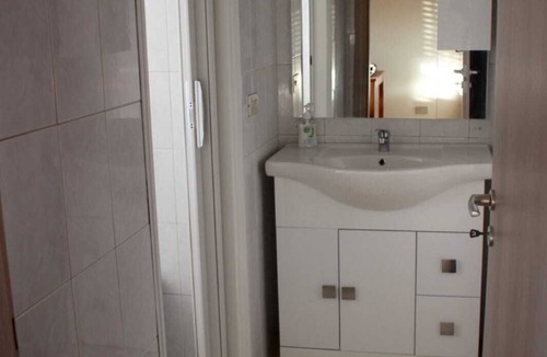 Forze Armate - Sella Nuova Apartment | CHECK-INGANNI, above MM1 Inganni and alongside the Italian Diagnostic Center