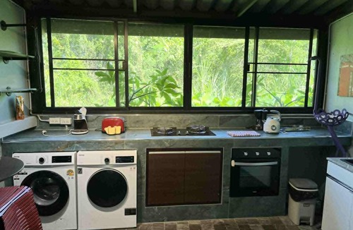 Hai Ya House | Chef’s kitchen-multiple balconies- eye popping art-this duplex has it all