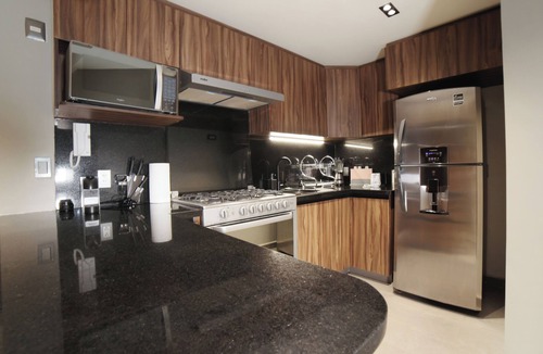 Colonia Cuauhtemoc Apartment | Chic CDMX Haven: Pop Modern Elegance Meets Roma's
