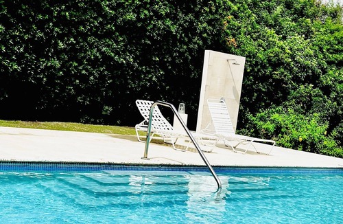 West Coast Condo | Chic Condo in Central Location—Pool, Gated, WiFi