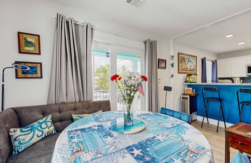 Eden Pines House | Coastal canalfront home with swim spa, dock, kayaks, e-bikes & dog friendly