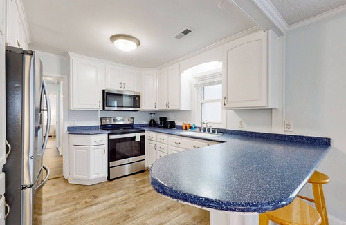 Kure Beach Cottage | Coastal cottage with short walk to the beach and fishing pier