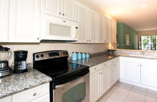 Coco Condo | Colorful Poolside Condo w/Garden-View Patio & Resort-Style Amenities