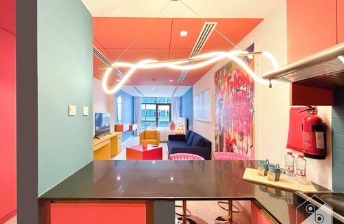 Dubai Sports City Apartment | Colorful Studio with Balcony & City Views