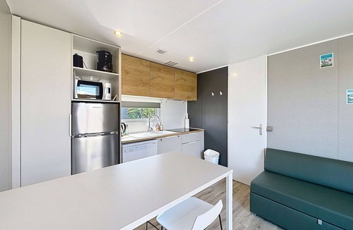 Jullouville-les-Pins House | Comfortable 2-Bedroom Mobile Home with Terrace, Near Beach, Pool & Parking in Jullouville