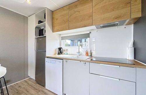 Jullouville-les-Pins House | Comfortable 2-Bedroom Mobile Home with Terrace, Near Beach, Pool & Parking in Jullouville