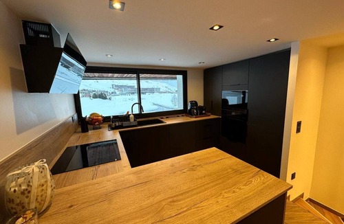 Val Claret Ski Chalet | Comfortable 4* lakeside chalet in the middle of the golf course, ski in, ski out