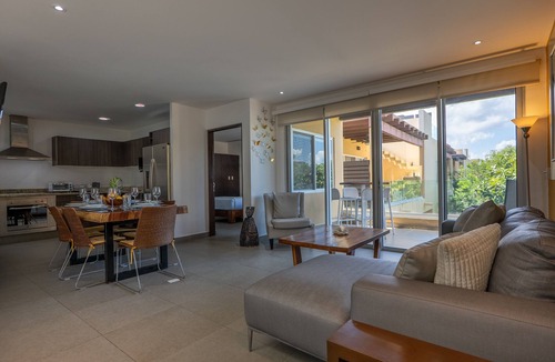 Playacar Fase II Condo | Comfortable family condo with rooftop jetted hot tub, pool & full kitchen