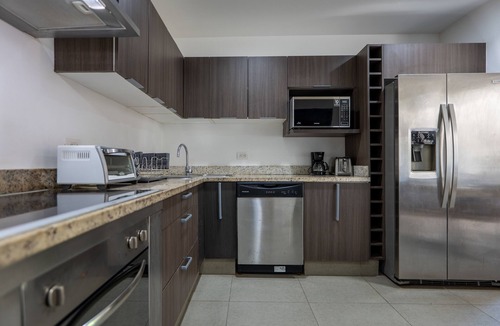 Playacar Fase II Condo | Comfortable family condo with rooftop jetted hot tub, pool & full kitchen