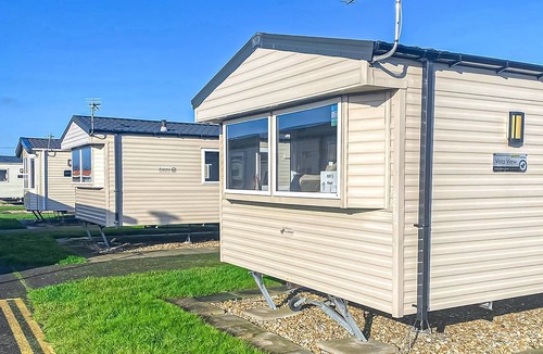 Chapel Saint Leonards Cottage | Comfortable bungalow with one double and one twin.