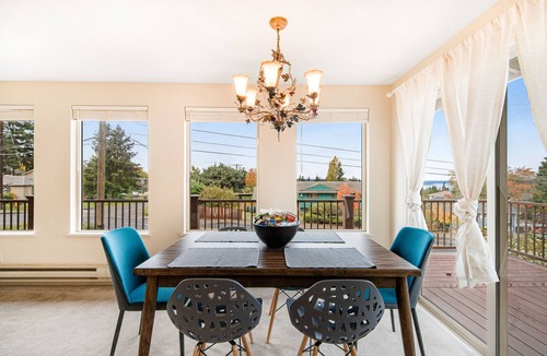 University Place House | Comfortable home with Puget Sound view, decks, garden patio, WiFi & W/D