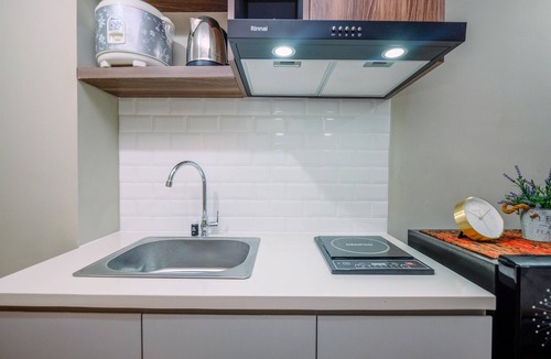 Duren Sawit Apartment | Comfortable Pool View Studio Room at LRT City Jatibening Apartment