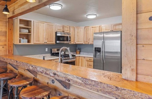 Clark Bed & Breakfast | Comfortable private queen room in the True North Adventure Lodge. Includes a queen bed, private ensuite bathroom, and access to shared amenities like the kitchen, great room, and hot tub. Great for couples or solo travelers.