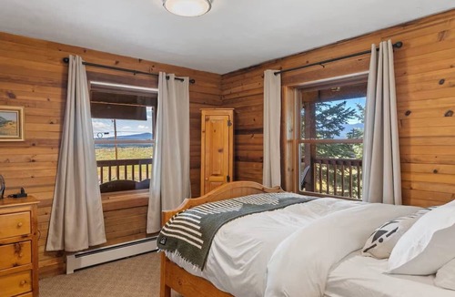 Clark Bed & Breakfast | Comfortable private queen room in the True North Adventure Lodge. Includes a queen bed, private ensuite bathroom, and access to shared amenities like the kitchen, great room, and hot tub. Great for couples or solo travelers.