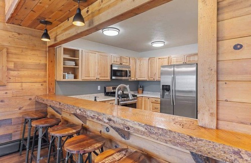 Clark Bed & Breakfast | Comfortable private queen room in the True North Adventure Lodge. Includes a queen bed, private ensuite bathroom, and access to shared amenities like the kitchen, great room, and hot tub. Great for couples or solo travelers.