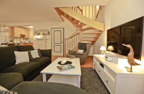 Zingst Apartment | Comfortable semi-detached house with terrace, garden view and pool in Zingst -