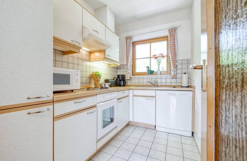 Zingst Apartment | Comfortable Windrose vacation apartment with balcony, pool and garden view in Zingst -