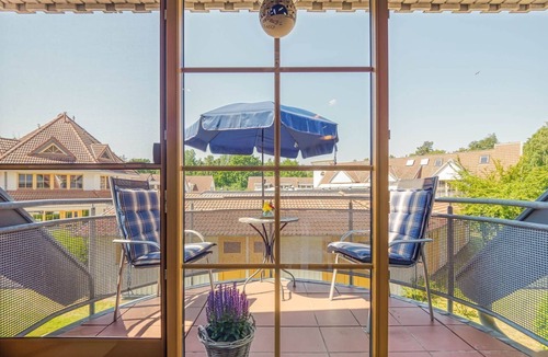 Zingst Apartment | Comfortable Windrose vacation apartment with balcony, pool and garden view in Zingst -