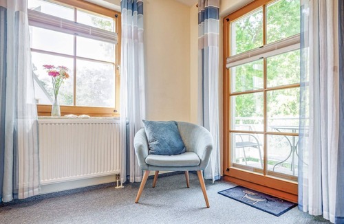 Zingst Apartment | Comfortable Windrose vacation apartment with balcony, pool and garden view in Zingst -